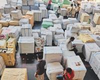 Surat : Textile Traders Express Frustration Over 65-Kilogram Weight Limit on Parcels Amidst Market Resurgence