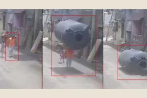 Surat: Young Man Narrowly Escapes Injury as Water Tank Plummets